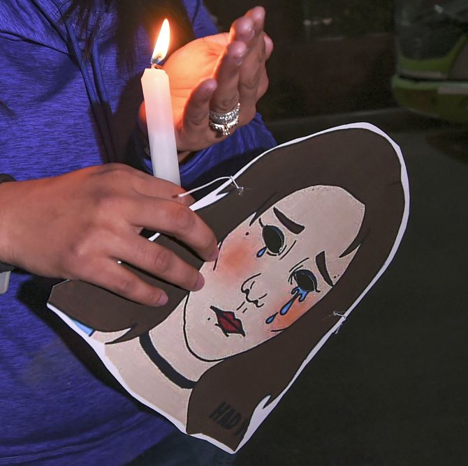  Indian Youth Congress (IYC) activists hold a candlelight march demanding justice for rape victims, at UP Bhawan in New Delhi, Saturday, Dec. 7, 2019. (PTI Photo/ Shahbaz Khan)
