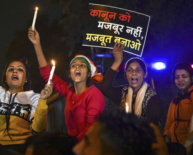  Activists take part in a candlelight march in solidarity with rape victims and to highlight the issue of violence against women in the country, at ITO, in New Delhi, Saturday, Dec. 7, 2019. (PTI Photo/Arun Sharma)