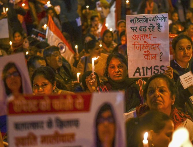 Activists take part in a candlelight march in solidarity with rape victims and to highlight the issue of violence against women in the country, at ITO, in New Delhi, Saturday, Dec. 7, 2019. (PTI Photo/Arun Sharma)