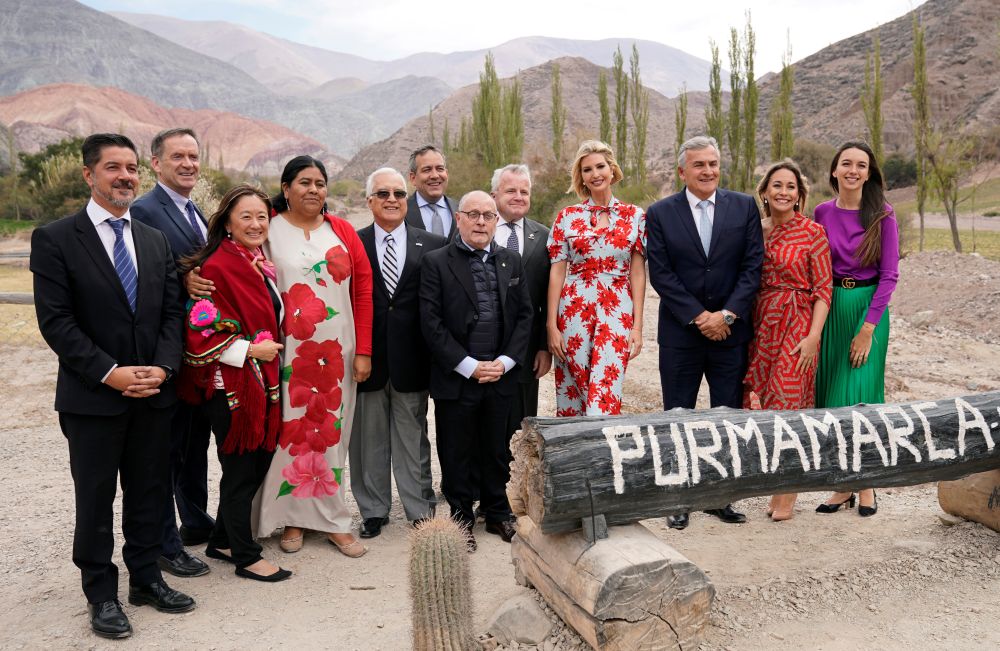 Members of the U.S. and Argentine delegations pose with White House adviser Ivanka Trump at a scenic viewing stop in Purmamarca, Argentina September 5, 2019.  REUTERS/Kevin Lamarque
