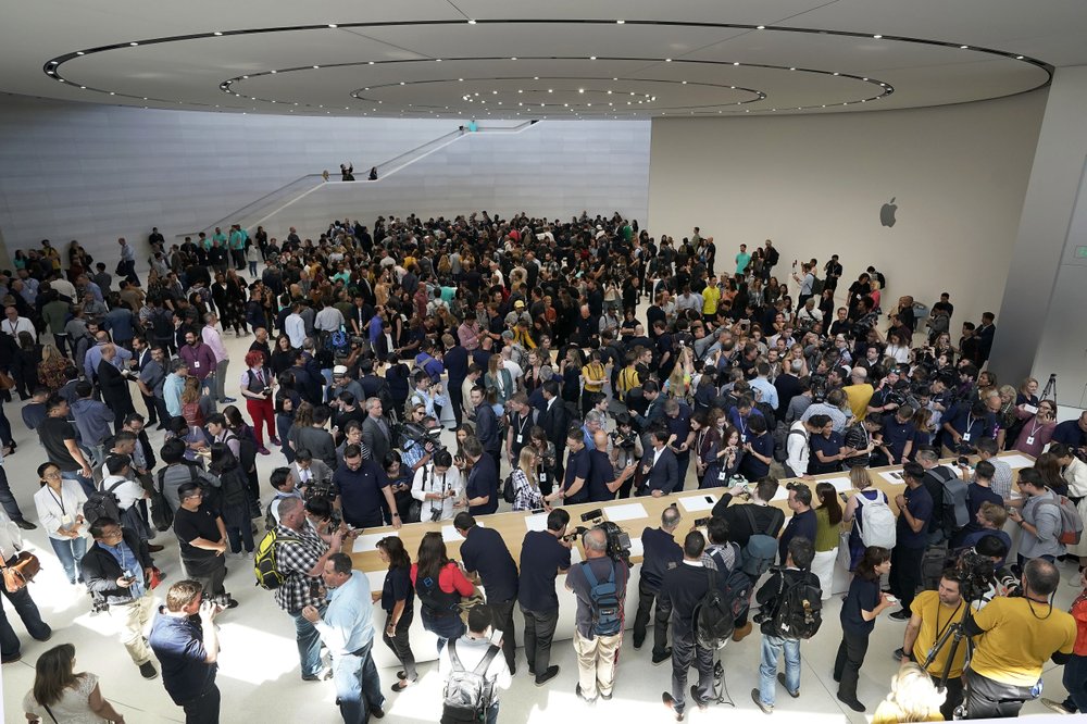 Event attendees get a look at the new products at the Steve Jobs Theater during an event to announcement Tuesday, Sept. 10, 2019, in Cupertino, Calif. (AP Photo/Tony Avelar)
