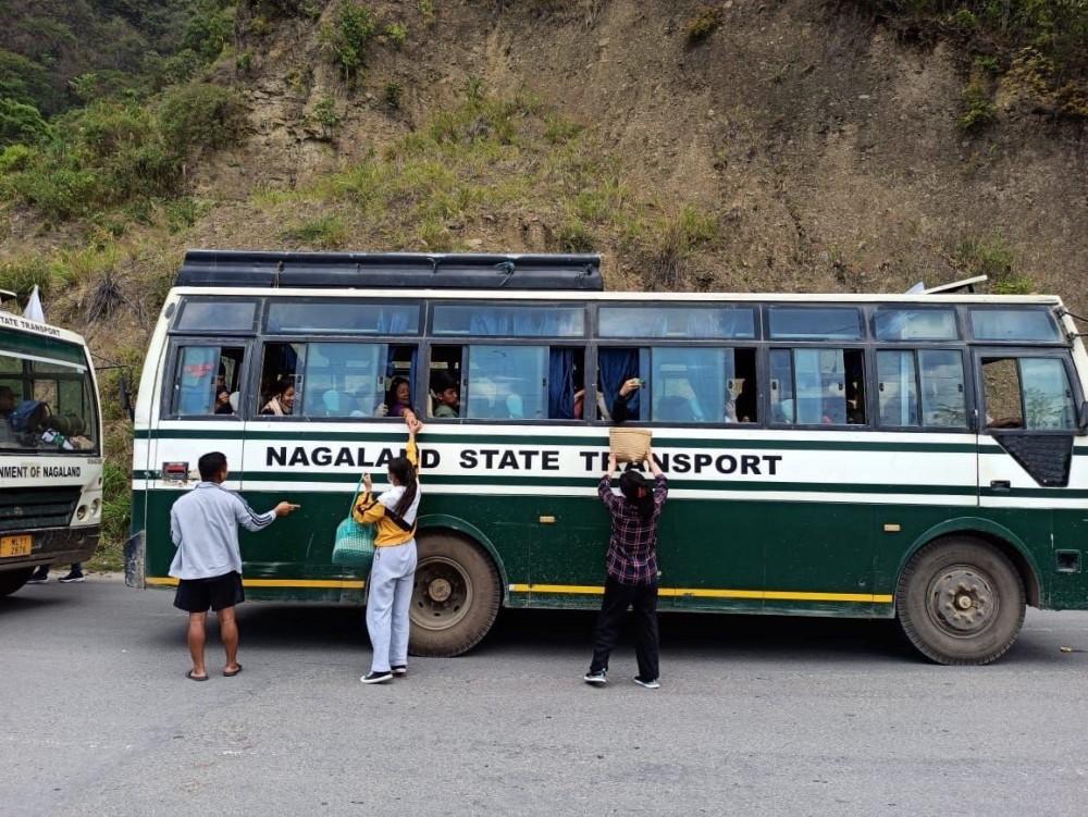 Members of Mao Union Senapati offer refreshment to citizens of Nagaland, being evacuated from Imphal as well as their escorts in Senapati on May 7.