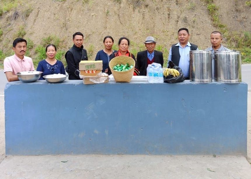 Members of Mao Union Senapati offer refreshment to citizens of Nagaland, being evacuated from Imphal as well as their escorts in Senapati on May 7.