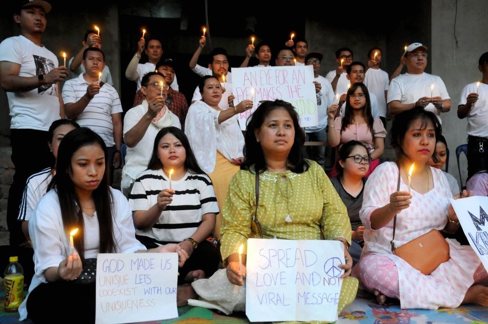 Kolkata: People from Manipur stage a candle light protest for peace and well-being of all Manipuri's people during recent Manipur violence, in Kolkata, on Sunday, May 07, 2023. (Photo:Kuntal Chakrabarty/IANS)