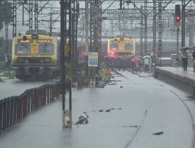 Heavy rains pound Mumbai; train services hit