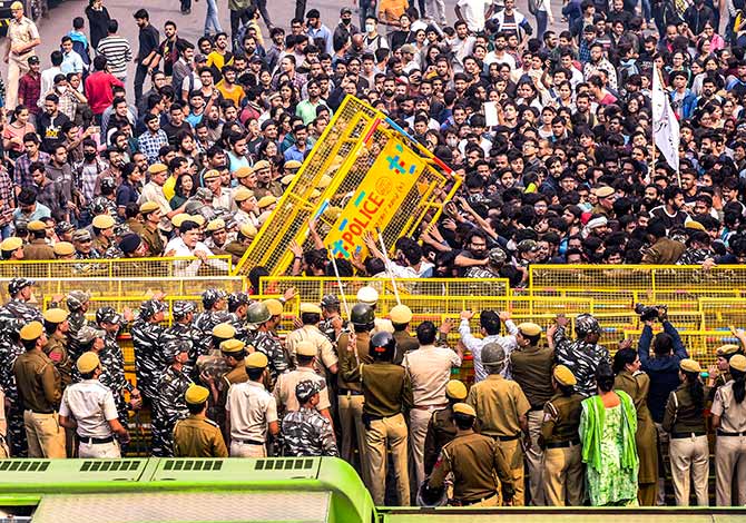 Jawaharlal Nehru University students clash with police during a protest against the administration in New Delhi. Photograph: PTI Photo