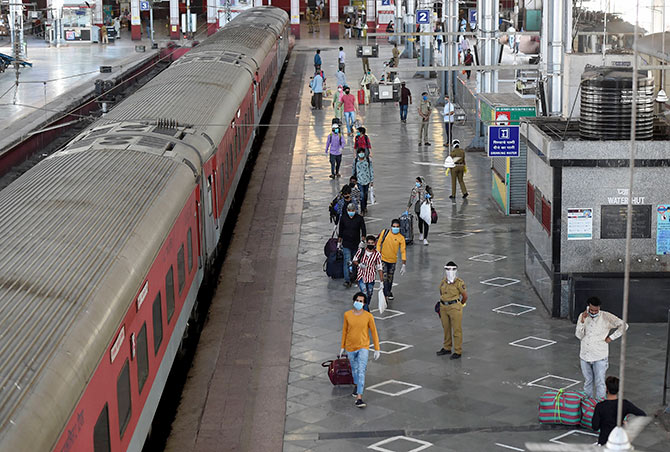 People with their luggage walk to board a special train for New Delhi from Mumbai Central railway station in Mumbai. Photograph: Kunal Patil/PTI Photo
