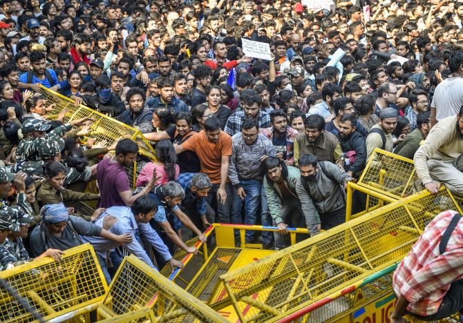 Jawaharlal Nehru University students try to get past police barricades during a protest march towards Parliament, on the first day of the Winter Session, demanding a total rollback of the hostel fee hike, in New Delhi, on Monday. Photograph: Ravi Choudhar