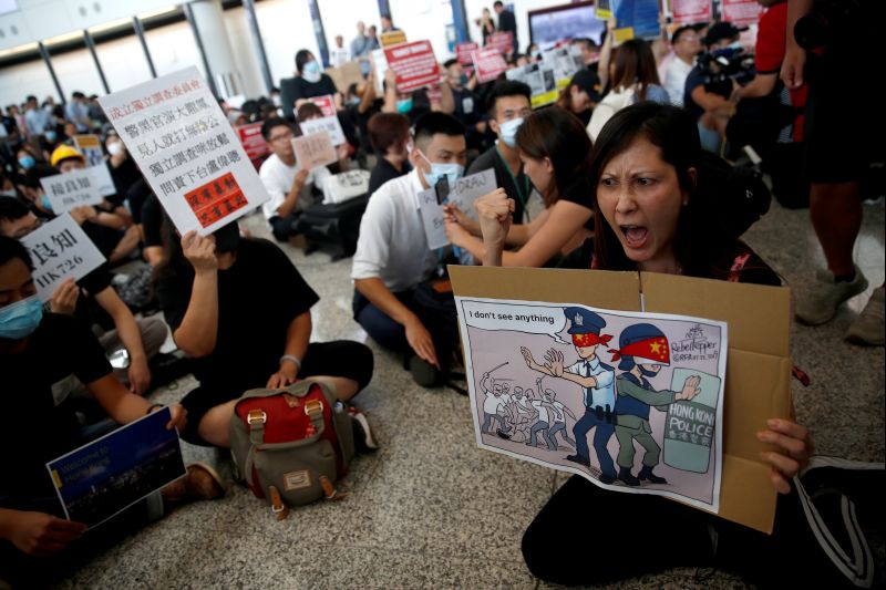 Protesters and members of the aviation industry stage a protest against the recent violence in Yuen Long, at Hong Kong airport, China July 26, 2019. REUTERS/Edgar Su