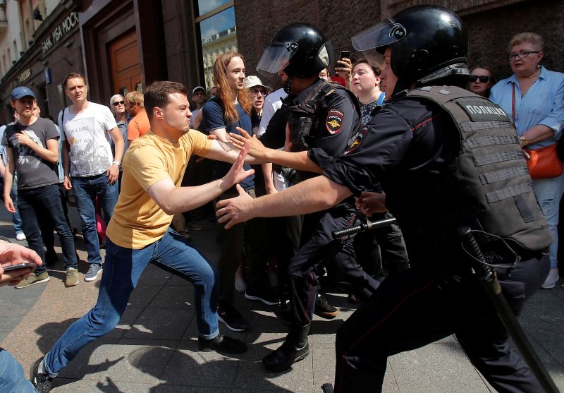 Law enforcement officers detain a participant of a rally calling for opposition candidates to be registered for elections to Moscow City Duma, the capital's regional parliament, in Moscow, Russia July 27, 2019. REUTERS/Maxim Shemetov
