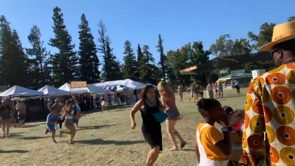 Motive a mystery as California police hunt for accomplice in festival shooting