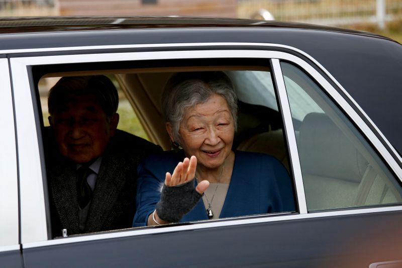 Japan's Empress Michiko waves to well-wishers from a vehicle at Kodomonokuni in Yokohama, south of Tokyo, Japan, April 12, 2019. REUTERS/Issei Kato/Files