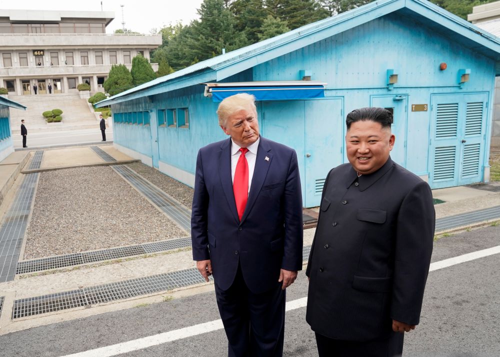 U.S. President Donald Trump meets with North Korean leader Kim Jong Un at the demilitarized zone separating the two Koreas, in Panmunjom, South Korea, June 30, 2019. REUTERS/Kevin Lamarque/Files