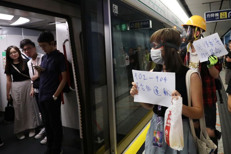 Hong Kong protesters gather at mob-attack subway as bank warns of economic fallout
