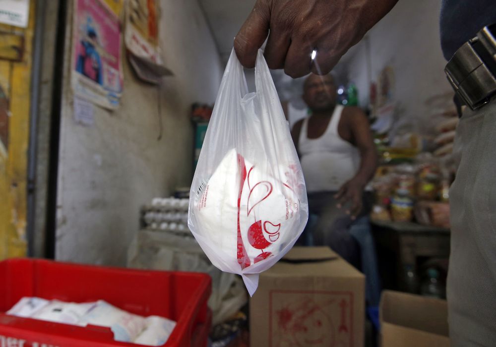 A man buys a packet of milk at a shop in Kolkata, India, September 17, 2019. REUTERS/Rupak De Chowdhuri