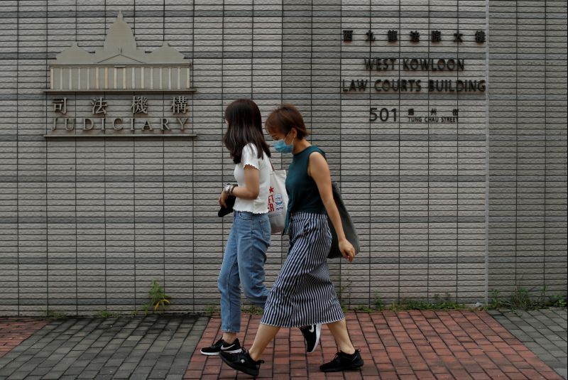 Dozens of Hong Kong protesters appear in court on rioting charges