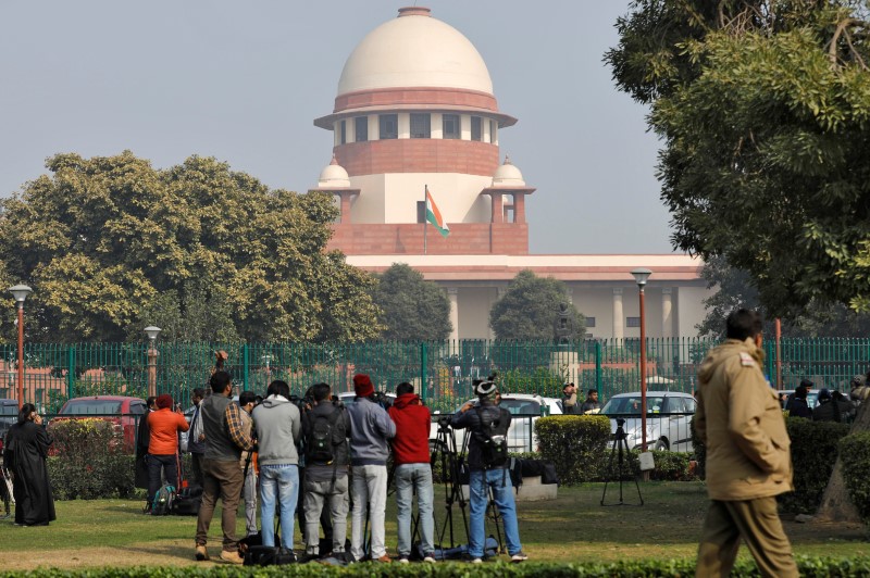 Television journalists are seen outside the premises of the Supreme Court in New Delhi, January 22, 2020. REUTERS/Anushree Fadnavis