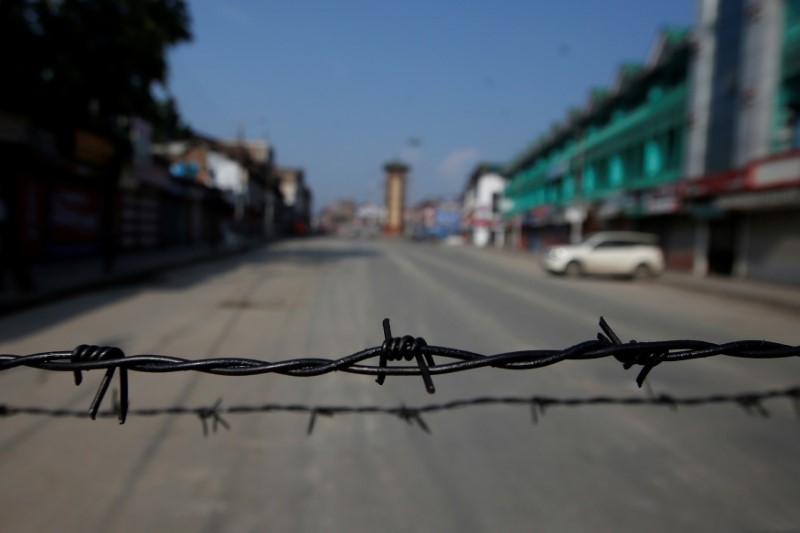Barbed wire is seen laid on a deserted road during restrictions in Srinagar, August 5, 2019. REUTERS/Danish Ismail /File Photo