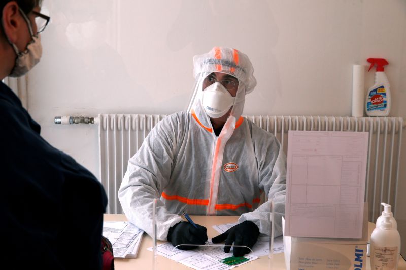 A French doctor wearing a protective suit works in a testing site for the coronavirus disease (COVID-19) in Gouzeaucourt, France, April 28, 2020. REUTERS/Pascal Rossignol/File Photo