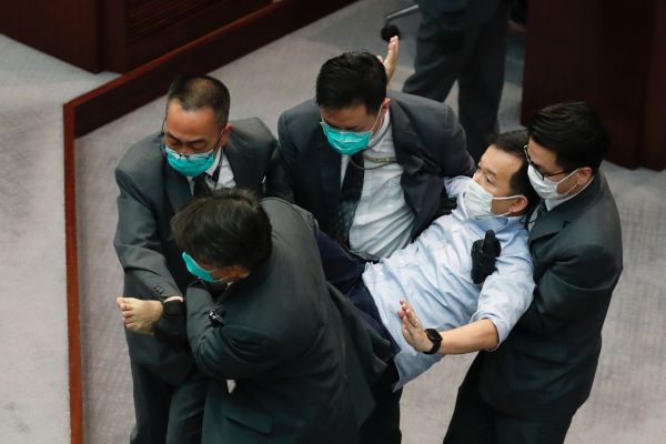 Pro-China and democratic lawmakers scuffle in Hong Kong legislature