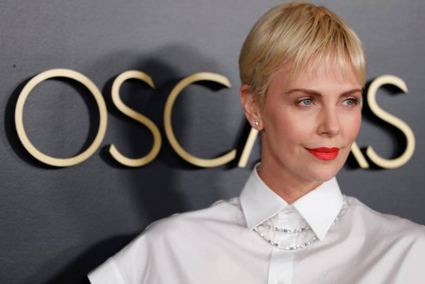 Actress Charlize Theron unveils stars joining her fight on domestic abuse