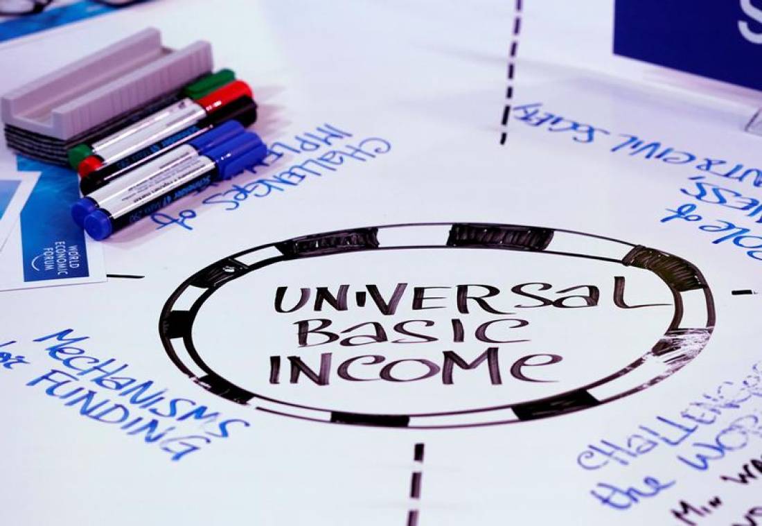Universal Basic Income (UBI) is written on a table during a session at the World Economic Forum (WEF) annual meeting in Davos, Switzerland January 23, 2018 REUTERS/Denis Balibouse