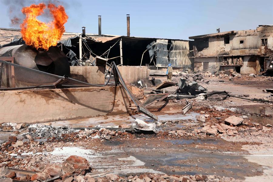 Flames rise from a tile manufacturing unit after an explosion in an industrial zone, north Khartoum, Sudan, 03 December 2019. EPA-EFE/MARWAN ALI