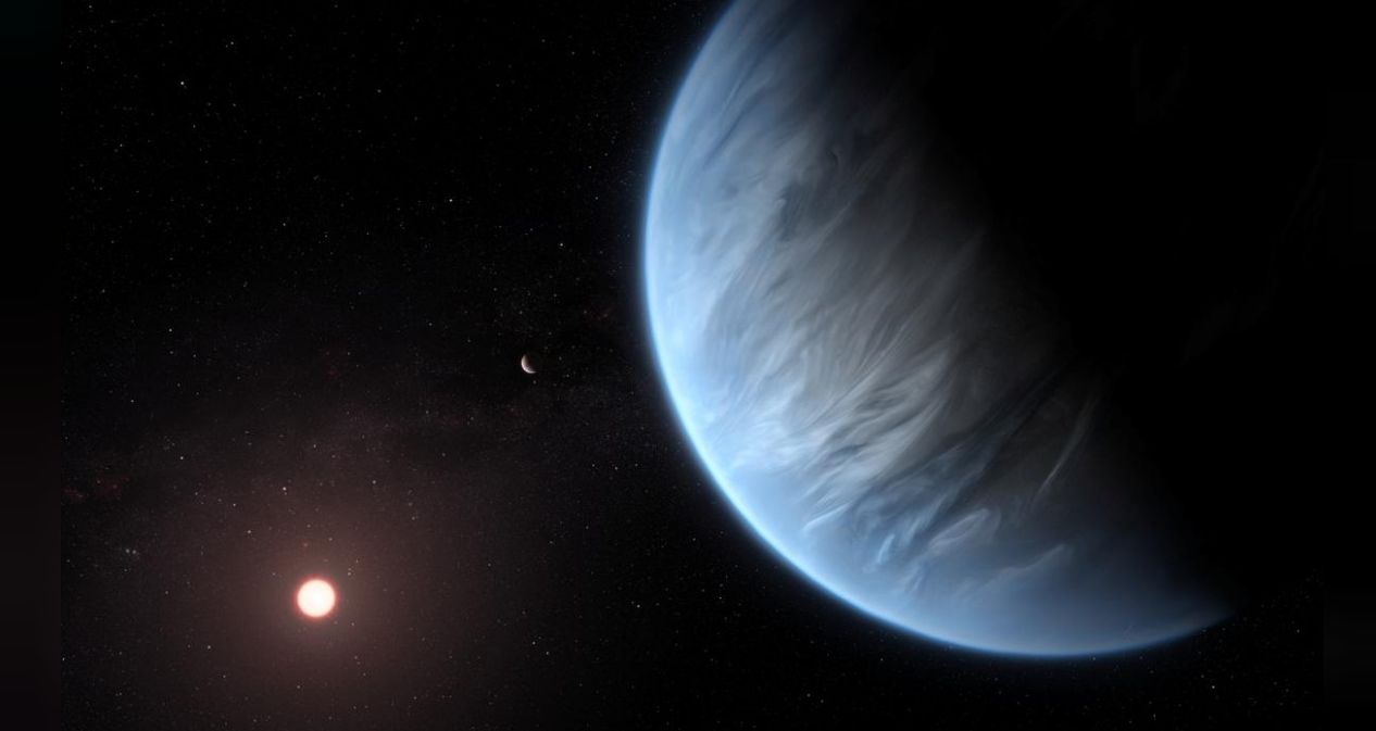 An artist's impression released by NASA on September 11, 2019 shows the planet K2-18b, its host star and an accompanying planet. Courtesy ESA/Hubble/M. Kornmesser/NASA Handout via REUTERS