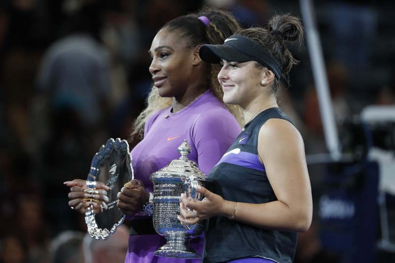 Sep 7, 2019; Flushing, NY, USA; Bianca Andreescu of Canada (R) holds the championship trophy as Serena Williams of the United States (L) holds the finalistÃ•s trophy during the trophy ceremony after their match in the womenÃ•s final on day thirteen of the 2019 US Open tennis tournament at USTA Billie Jean King National Tennis Center. Mandatory Credit: Geoff Burke-USA TODAY Sports