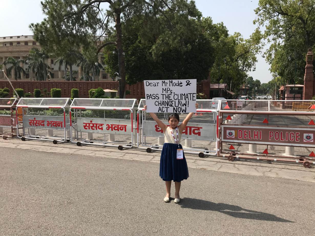Youth climate activist, Licypriya Kangujam, holds up a poster to demand a law on climate change outside the federal parliament in New Delhi, India on February 2, 2019. HANDOUT/The Child Movement