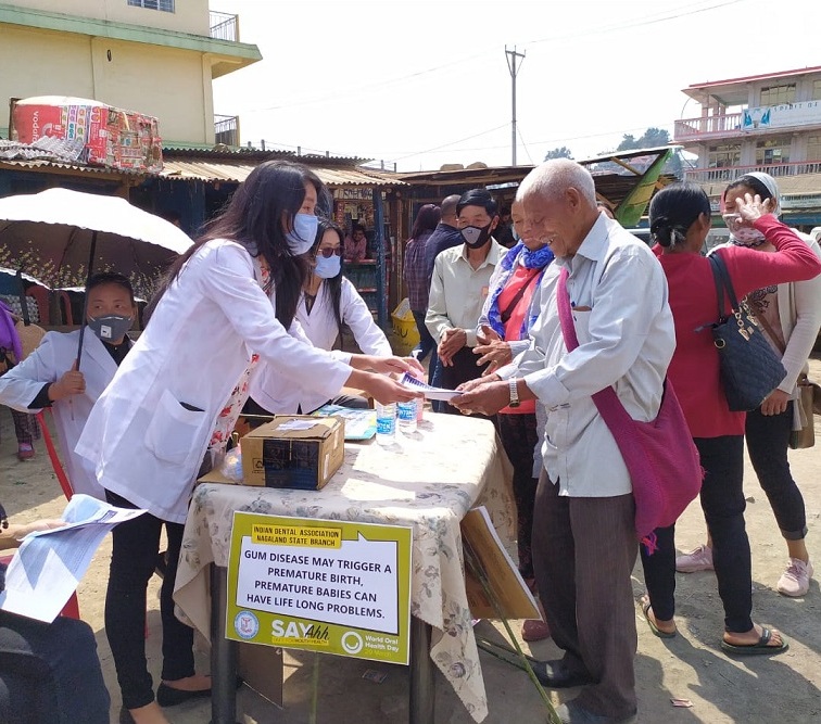 Dental doctors distribute leaflets on oral health, Coronavirus and face masks to elderly persons at Wokha. 