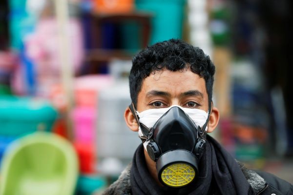 A man wears a protective face mask outside a shop amid concerns over the spread of the coronavirus disease (COVID-19), in Sanaa, Yemen on May 13, 2020. (REUTERS File Photo)