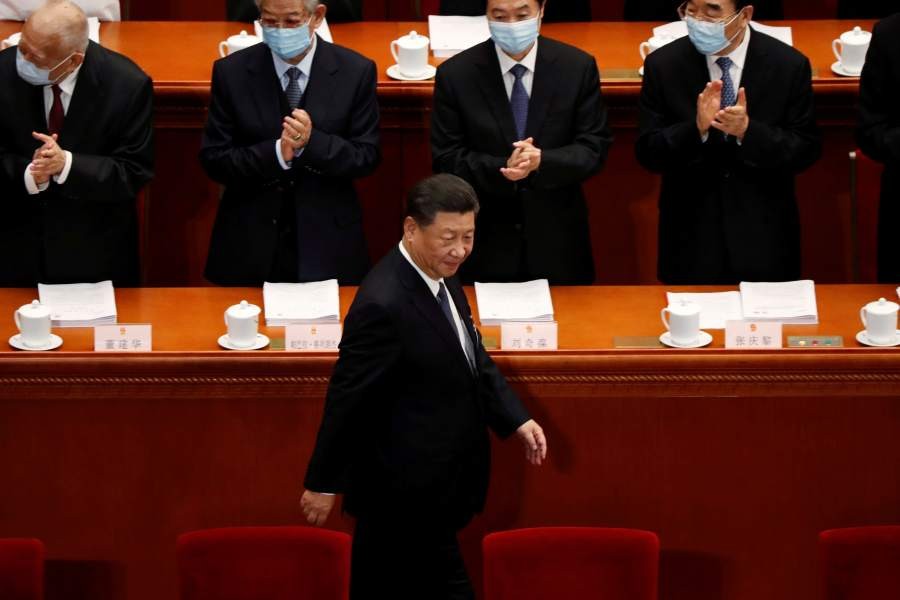 Chinese President Xi Jinping walks past officials wearing face masks following the coronavirus disease (COVID-19) outbreak as he arrives for the opening session of the National People's Congress (NPC) at the Great Hall of the People in Beijing, China May 22, 2020. (REUTERS/File Photo)