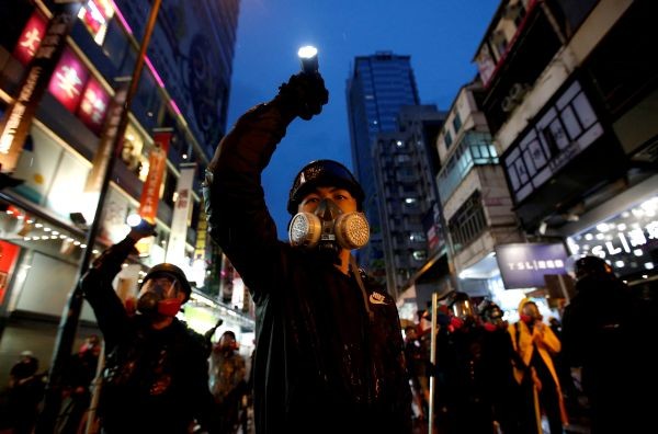 Demonstrators protesting the proposed extradition bill aim their flashlights towards riot police in Hong Kong streets on August 25, 2019. Reuters has been awarded the 2020 Pulitzer Prize in Breaking News Photography for Hong Kong protests. (REUTERS File P