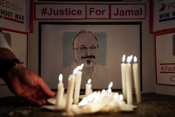 The Committee to Protect Journalists and other press freedom activists hold a candlelight vigil in front of the Saudi Embassy to mark the anniversary of the killing of journalist Jamal Khashoggi at the kingdom's consulate in Istanbul, Wednesday evening