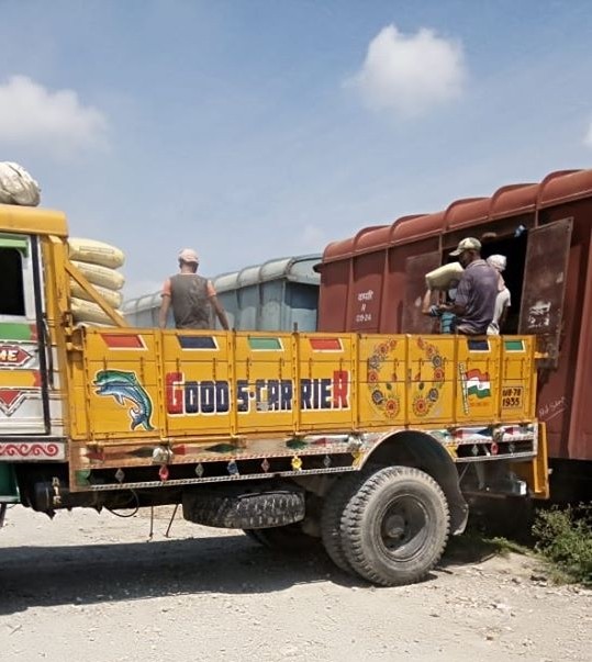 Workers are seen unloading essential items from a train in this undated photo provided by Northeast Frontier Railway. The zone has already operated more than 1200 inbound freight trains during the lockdown period from March 25 to May 24 as per an NFR’s release. (Photo Courtesy: CPRO NFR)
