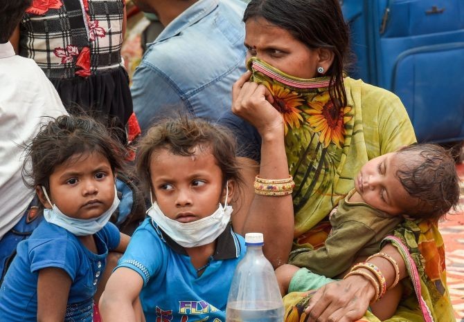 A migrant family lodged at a camp by the Uttar Pradesh government, during ongoing COVID-19 lockdown, at Dadri in Gautam Buddha Nagar district, on Wednesday. Photograph: Atul Yadav/PTI Photo