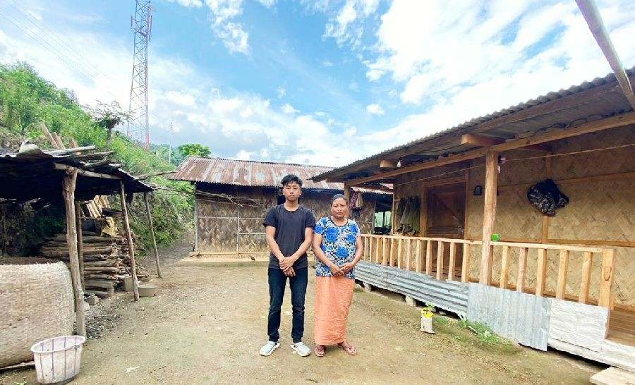 Chumliba R from LHSSK who secured Top-1 Position in HSSLC exam with his mother at Lihtsaoung Village, Kiphire town. (Morung Photo)