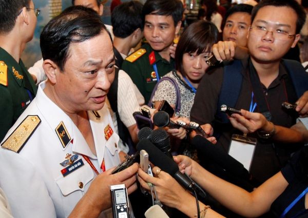 Vietnam's Vice Minister of Defence and Navy Commander in Chief Vice Admiral Nguyen Van Hien (L) speaks with media along the sides of the 5th ASEAN Navy Chiefs meeting in Hanoi July 27, 2011. (REUTERS File Photo)