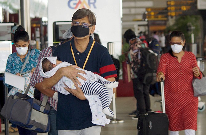  Passengers arrive at T3 of IGI airport for domestic travel after the resumption of flight services, in New Delhi. Photograph: Kamal Kishore/PTI Photo