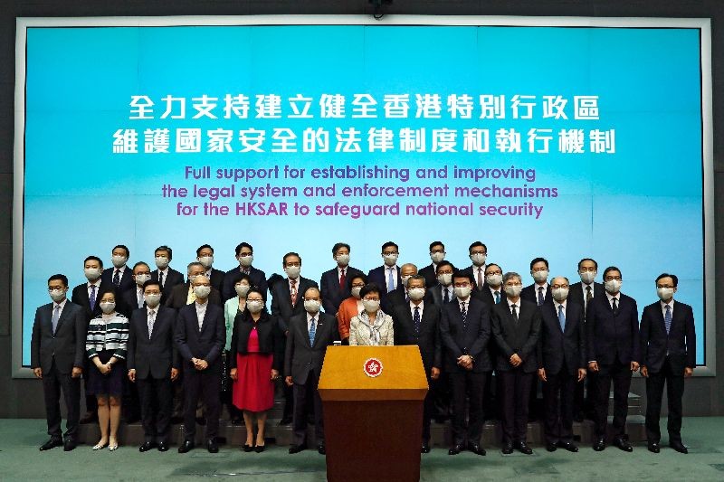 Hong Kong Chief Executive Carrie Lam, wearing a face mask following the coronavirus disease (COVID-19) outbreak, attends a news conference with officers over Beijing's plans to impose national security legislation in Hong Kong, China May 22, 2020. REUTERS/Tyrone Siu/File photo