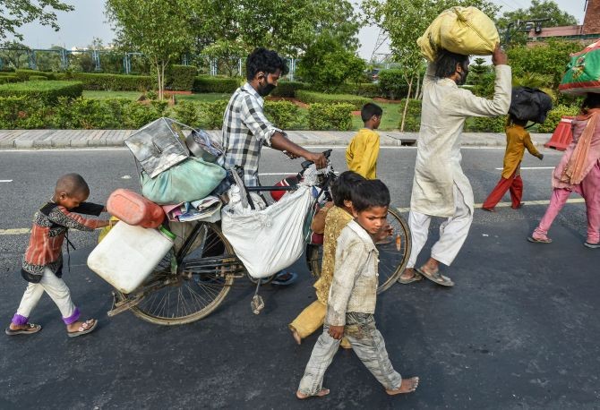 Mukesh and his family with their physically challenged daughter travel towards their native place in UP, during the ongoing COVID-19 nationwide lockdown. Photograph: Arun Sharma/PTI Photo