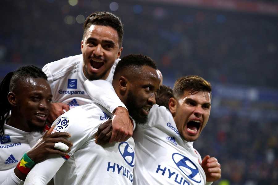 Olympique Lyonnais' Moussa Dembele celebrates scoring their second goal with teammates REUTERS/File Photo