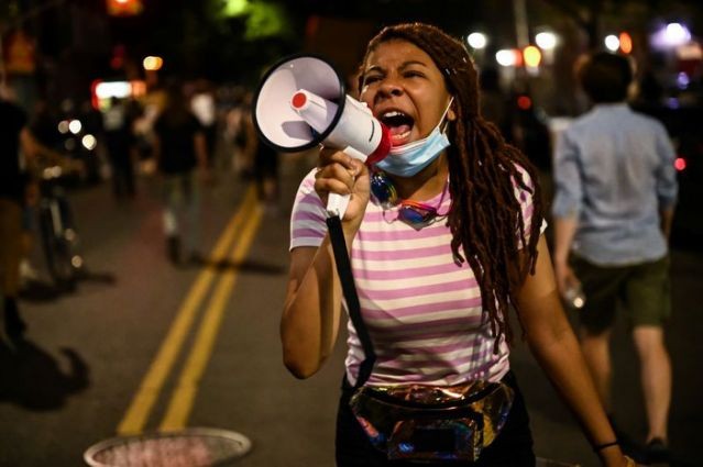 A demonstrator uses a megaphone during a protest against racial inequality in the aftermath of the death in Minneapolis police custody of George Floyd, in New York City, New York, U.S. June 9, 2020. Picture taken June 9, 2020. (REUTERS Photo)