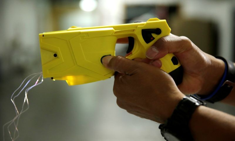 Montgomery County, Maryland police officer and instructor Craig Dickerson demonstrates an X2 taser during a demonstration for Reuters at the department's training academy in Rockville, Maryland, US.   (REUTERS File Photo)