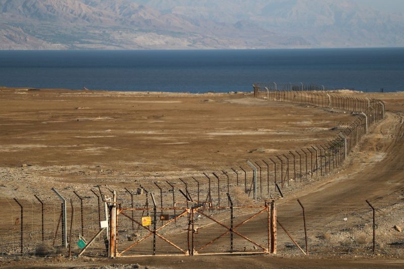 A view shows the Dead Sea with a border fence separating Jordan and the Israeli-occupied West Bank on June 19, 2020. (REUTERS Photo)