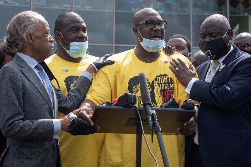 Philonise Floyd, brother of George Floyd, whose death in Minneapolis police custody has sparked nationwide protests against racial inequality, is held by Reverend Al Sharpton and attorney Ben Crump as he gets emotional during a speech during the public viewing of Floyd at The Fountain of Praise church in Houston, Texas, US on June 8, 2020. Standing in the background is George Floyd's younger brother Rodney Floyd.   (REUTERS Photo)