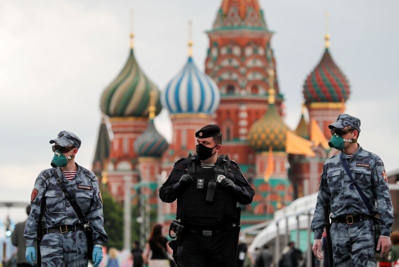 Russian law enforcement officers wearing protective face masks, used as a preventive measure against the spread of the coronavirus disease (COVID-19), walk at the annual Red Square Book Fair in central Moscow, Russia on June 6, 2020. (REUTERS Photo)