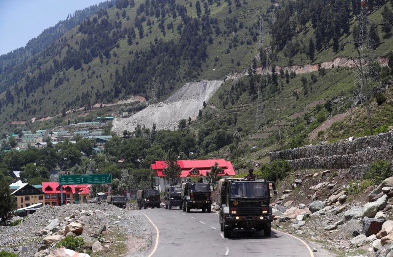 Indian army trucks move along a highway leading to Ladakh, at Gagangeer in Kashmir's Ganderbal district on June 17. (REUTERS Photo)