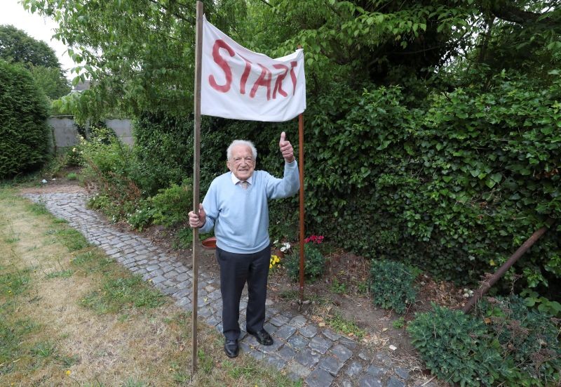 103-year-old Belgian oldest former general practitioner Alfons Leempoels poses next to a start line intending to walk the equivalent of a marathon in his garden to raise money for scientists researching the coronavirus disease (COVID-19) in Rotselaar, Belgium on June 9, 2020. (REUTERS Photo)